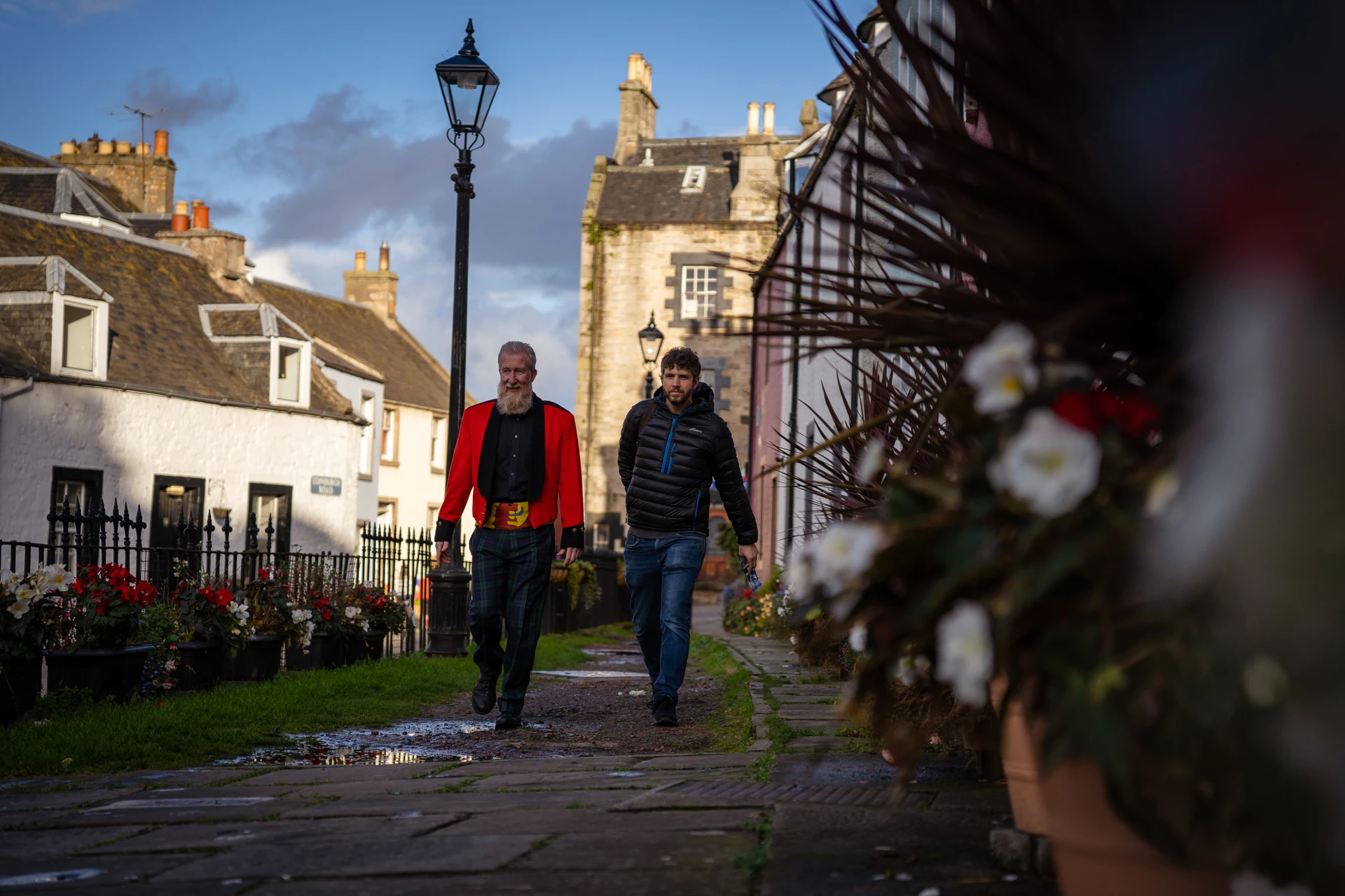 Background image - Men walking High Street, South Queensferry